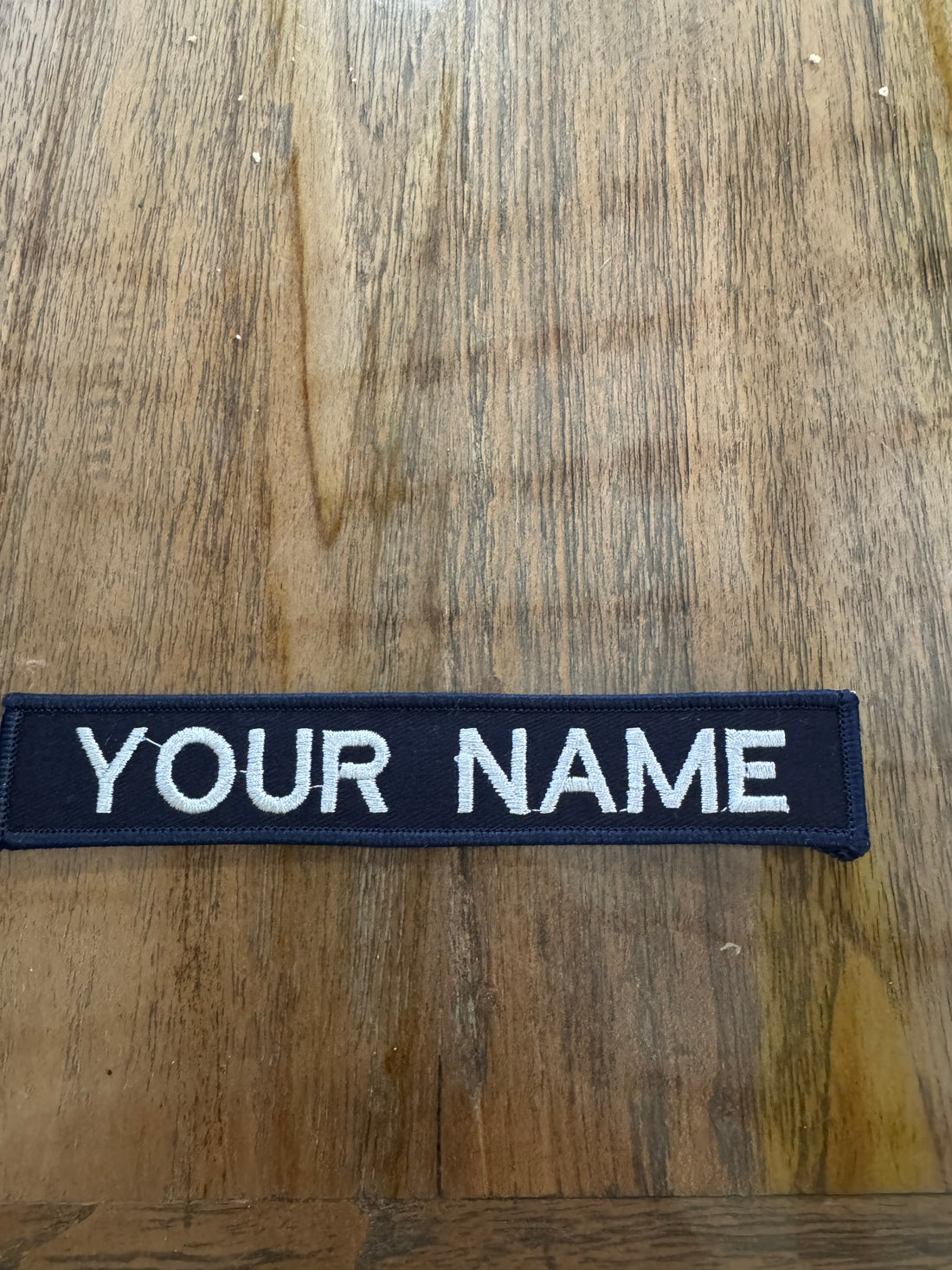 EMBROIDERED PERSONALISED NAME TAG WHITE ON BLUE